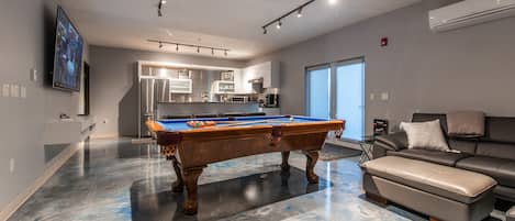Enjoy the entertainment-ready kitchen and lounge space. Pool table & 86" TV.