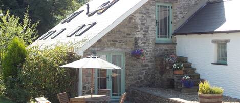 Orchid Cottage with picture window looking over the stables and fields