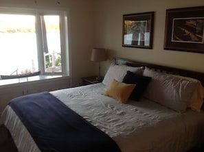 Master bedroom with king size bed looking out over Highland Lake.