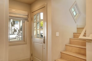 On the street level is the first master ensuite, a cozy retreat. Upstairs, the second level features a bright living area, a fully equipped kitchen, and another master ensuite, offering comfort and relaxation.