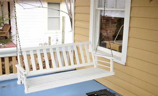 A porch swing for enjoying the quiet tree-lined street in historic OWL.