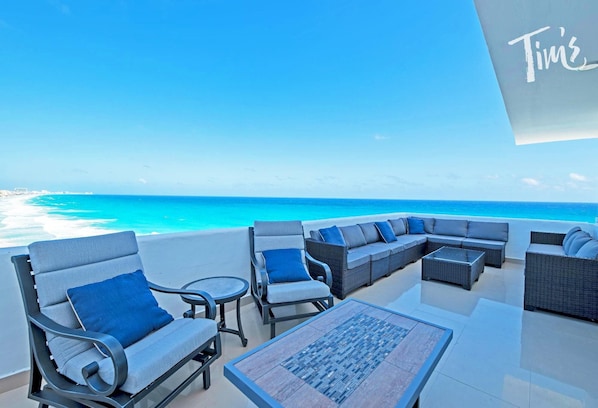The Expansive Terrace Faces Straight out to the Ocean &amp; Includes a Large Sofa Set, 2 Sun Loungers, and a Table with Seating for 6