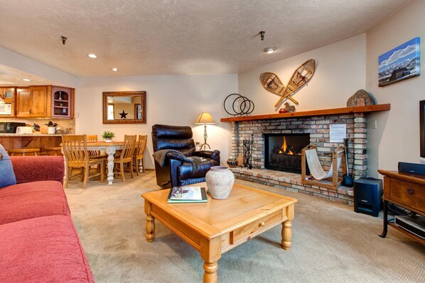 Cozy setup with a fireplace and wooden center.