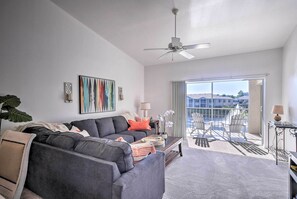 Relax on the sofa as you enjoy the fresh air from the private balcony.