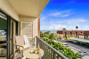 Private balcony with seating to enjoy morning coffee and a gentle sea breeze