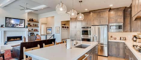 Jordanelle Estates 13299: Sleek countertop with modern appliances, perfect for culinary creations.