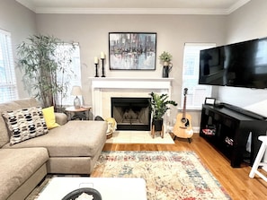 65" 4K tv, blu ray player with dvd's, board games, Epiphone guitar, Soundbar.