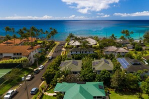 Walk from the cottage (green roof in forefront)  to the blue Pacific.