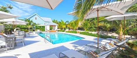 Lounge by Sea Orchard Retreat's large pool.