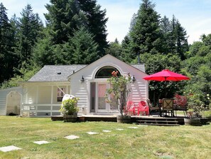 The back of the main house in summertime. 