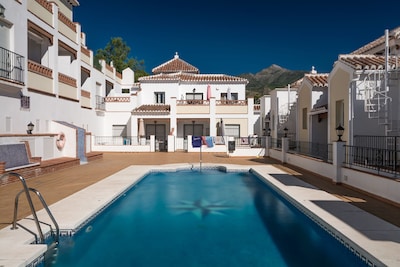 Nerja: Splendid and new 2 bedrooms apartment for 4 people with a terrace and a communal swimming pool, 10 minutes walk from the beach.