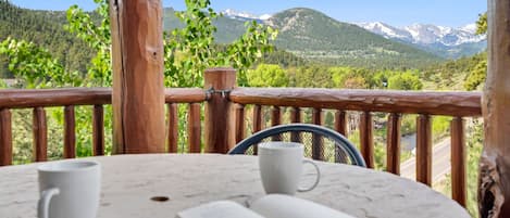 Outside on your patio looking out towards the mountains.