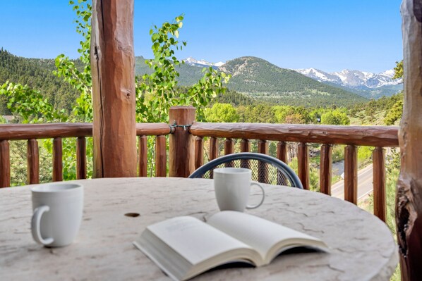 Outside on your patio looking out towards the mountains.