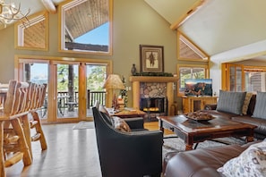 Upper Living area with dinning room table that seats 8