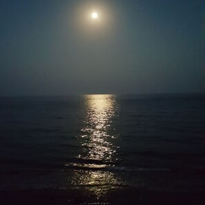 Moonlight reflecting in the  sea, seen whilst sitting by the poolside