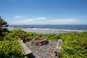 Gather around the seaside fire-pit.