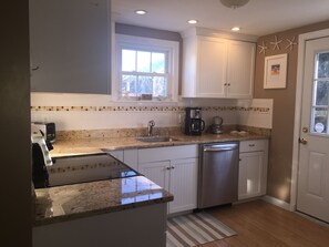 Full Kitchen-Door goes out to large deck.