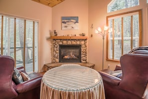 Sit by the cozy gas log fireplace