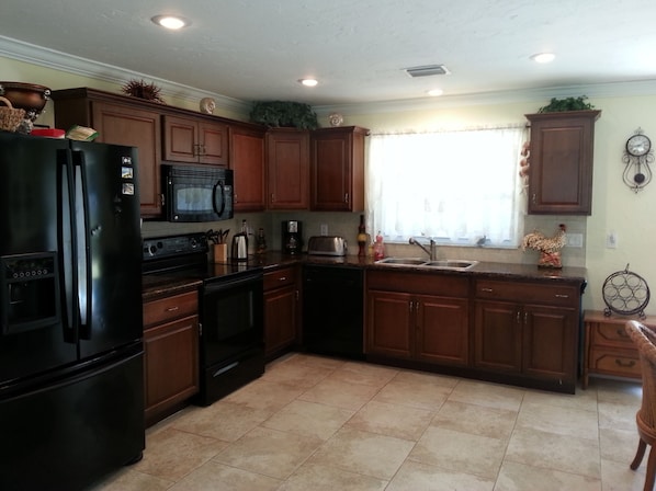 The kitchen is very clean, well maintained, and has modern appliances.