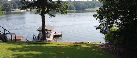 Covered dock with built in bench, swing and swim platform.