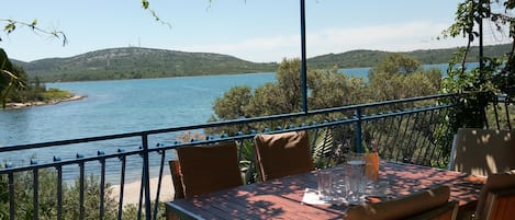 Terrace overlooking the sea and the beach which is right in front of the house.