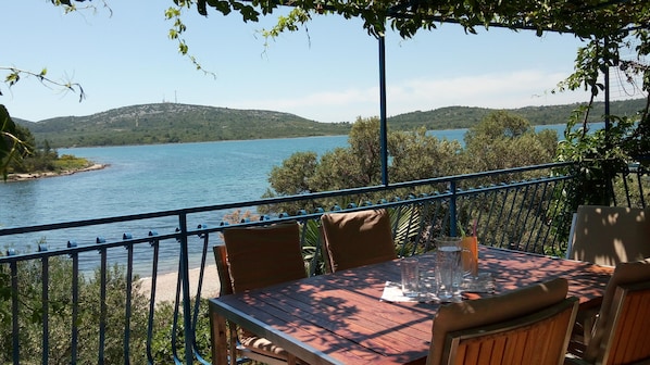 Terrace overlooking the sea and the beach which is right in front of the house.