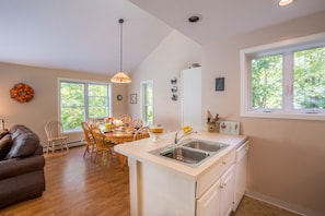 Cook in the kitchen while friends and family are close by