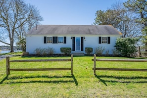 This quiet and unassuming home unveils two floors of living and sleep space, a recreation room and a massive deck as well - 84 Cranberry Lane Chatham Cape Cod -  Ridgevale Retreat