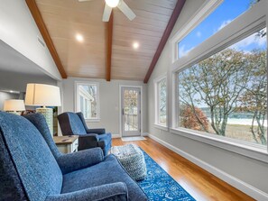 Vaulted ceilings, swivel chair seating, direct access to the deck  and panoramic views enjoyed throughout - 84 Cranberry Lane Chatham Cape Cod - Ridgevale Retreat