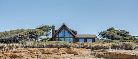 A lovely private home on a bluff above a beautiful sandy beach.