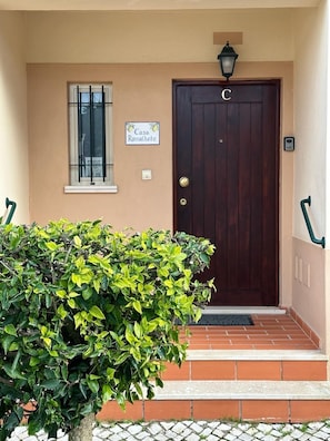 Front door with villa sign