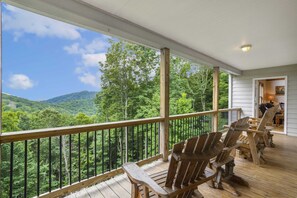 Covered Porch with Comfortable Rockers to Enjoy the Long-Range Views from Wildlife Manor