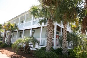 SIDE VIEW OF SEA LA VIEW W/HUGE WRAP AROUND PORCHES ON CORNER LOT.