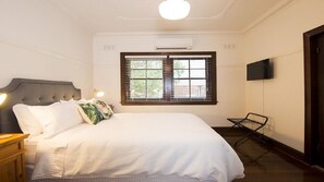 Master bedroom with Queen bed, flat screen TV, and reverse cycle air con.