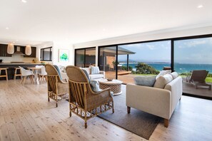 Main living area looking onto new outdoor pavilion.