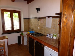 Old style kitchen well equiped at the trekking cottage apartment.