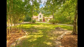 3 flat acres . Concrete ,easy semicircular parking . Beautiful yard.