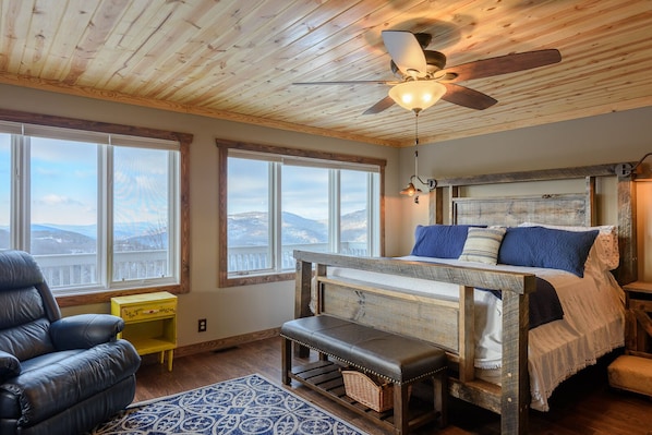 King Master Suite with Wall of Windows framing Mountain Views
