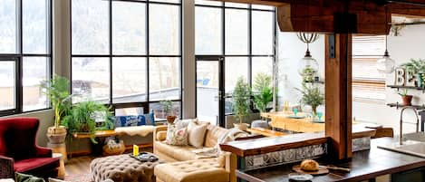 Floor to ceiling windows in Great Room; cedar beams