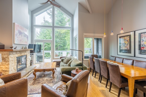 Open plan with cathedral ceiling over the living, dining and kitchen areas