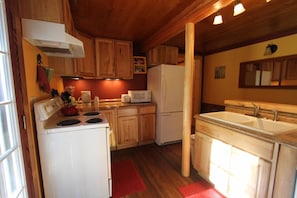 Fully equipped kitchen with outside deck.