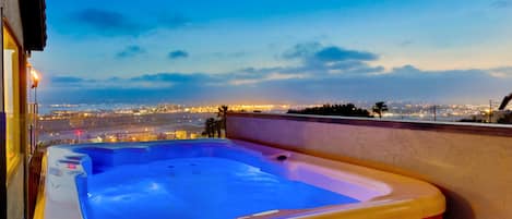 Indulge in luxury with a jacuzzi experience featuring breathtaking harbor views—a perfect relaxation spot.