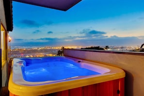 Indulge in luxury with a jacuzzi experience featuring breathtaking harbor views—a perfect relaxation spot.