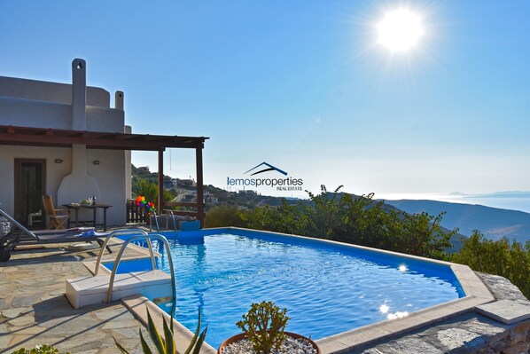 The house, pool and sea view.