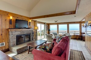 The woodburning fireplace and ocean views make this space a wonderful spot!