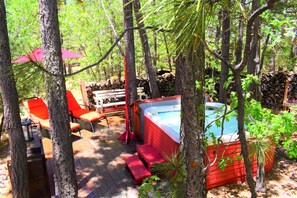 Spa deck has lighted solar power umbrella and two new chaise lounges