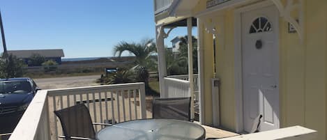 Unit entrance with side deck and beautiful view of beach