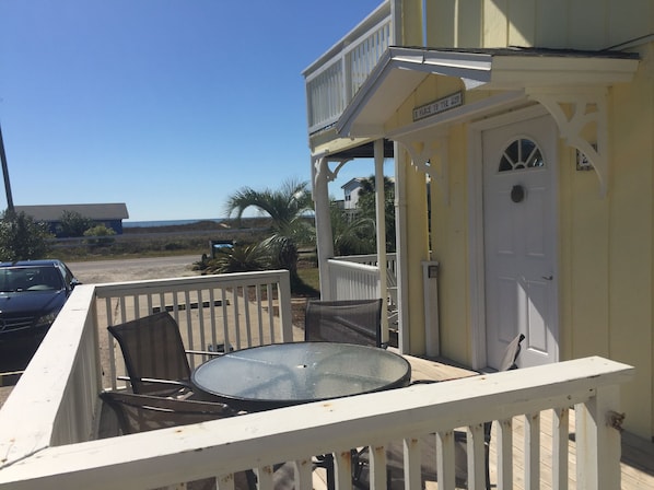 Unit entrance with side deck and beautiful view of beach