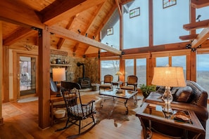 Wall of Windows in Great Room with Exposed Beam Vaulted Ceiling