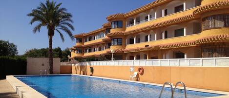 Pool and apartment (ground floor right) view